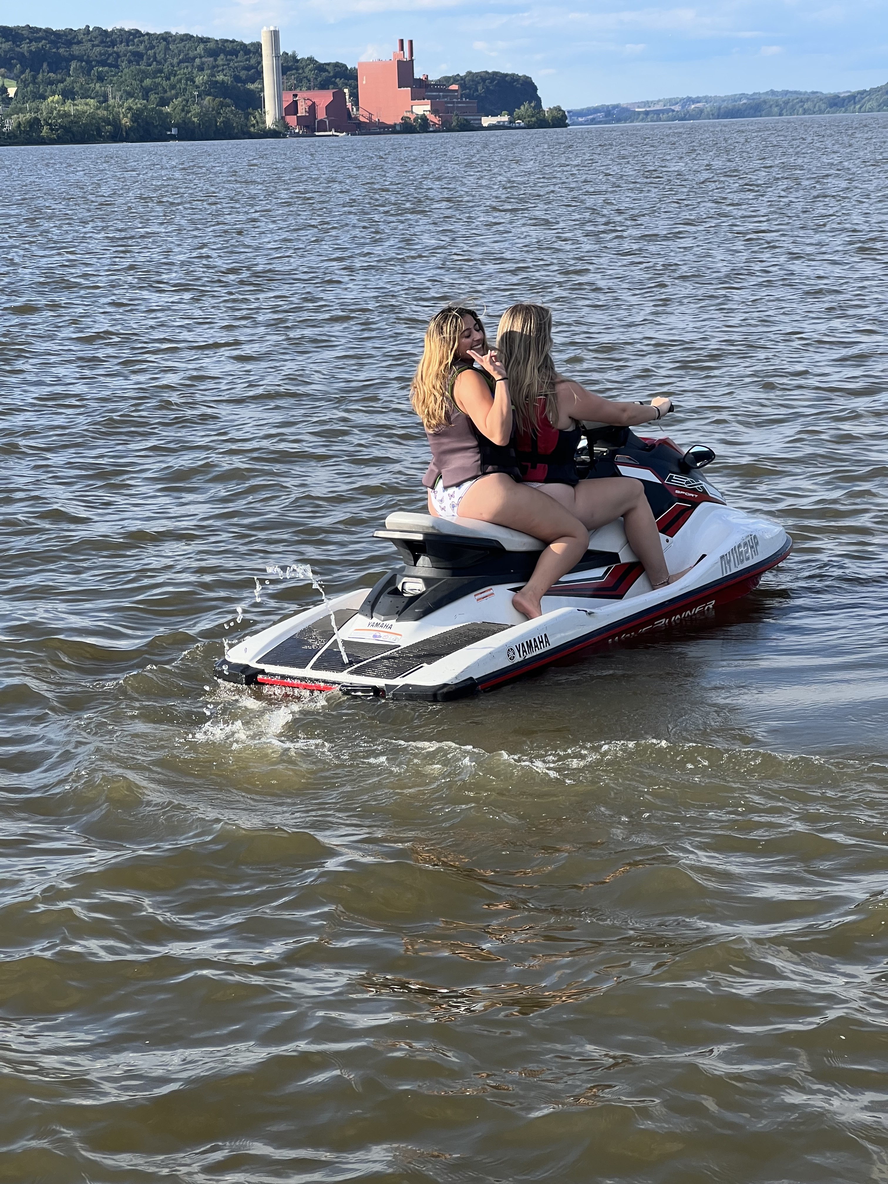 Two women riding a Yamaha WaveRunner on the Hudson River — girls trip Hudson Valley NY, summer activities near NYC, bachelorette weekend ideas New York
